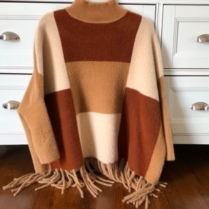 Turtleneck sweater with fringe